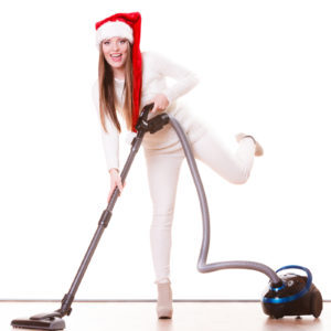A woman cleans her house ahead of the holidays
